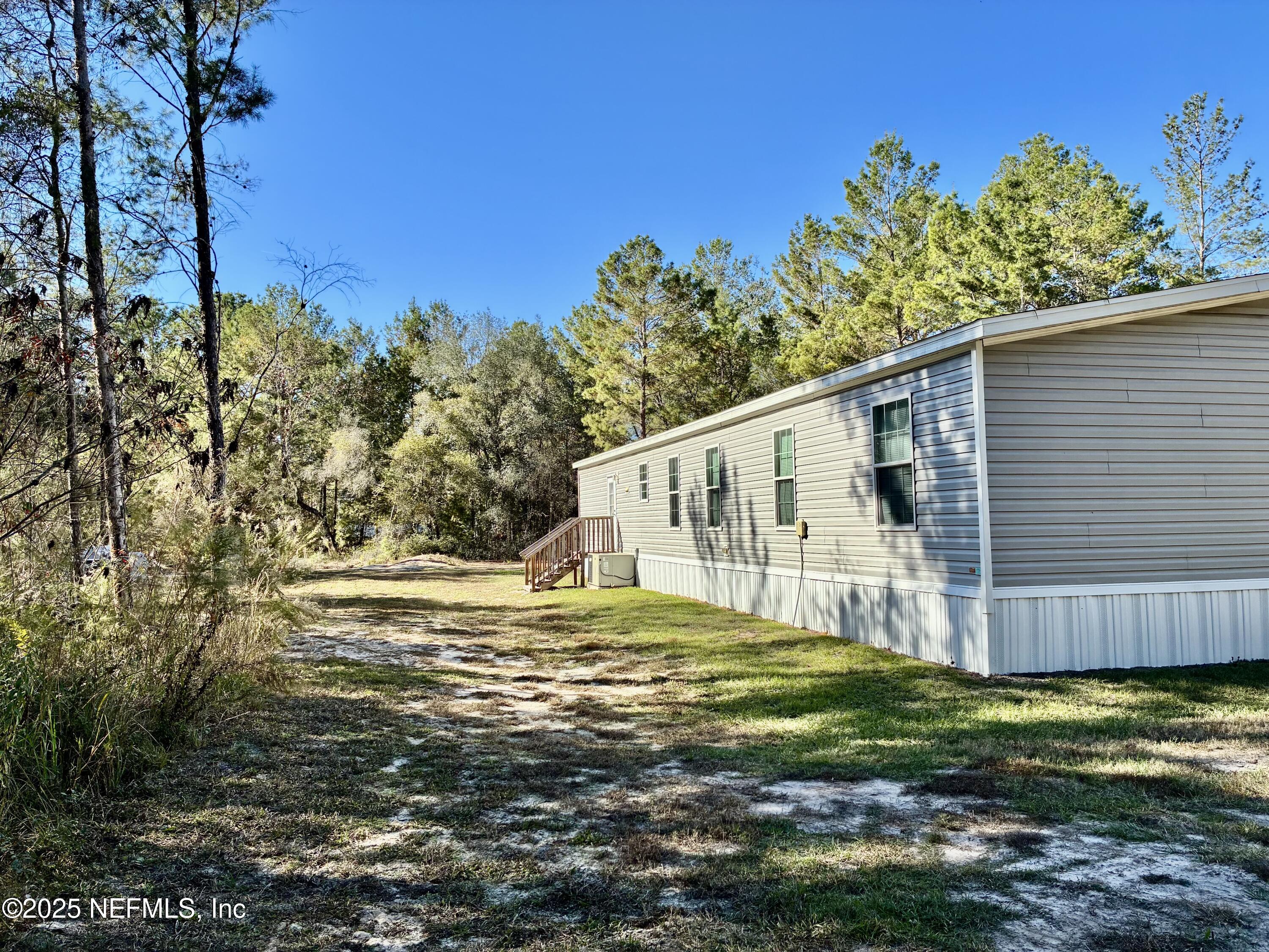 5915 Oak Leaf Road Keystone Heights, FL 32656 - Photo 10 of 44 a view of a house with a yard