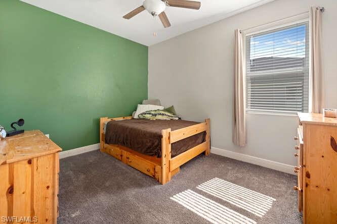 6564 Bay Ridge Way Fort Myers, FL 33908 - Photo 12 of 17 a bedroom with a bed and a window