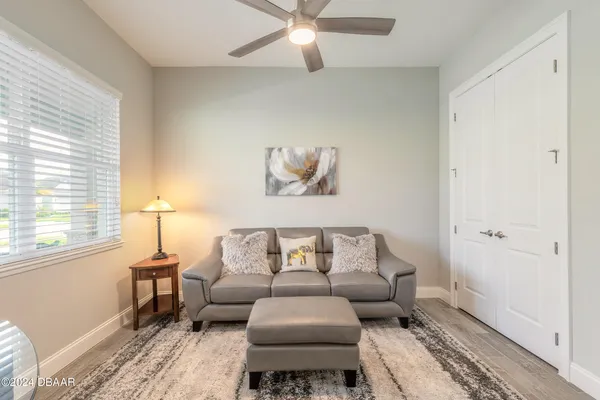 a bedroom with a bed and a couch