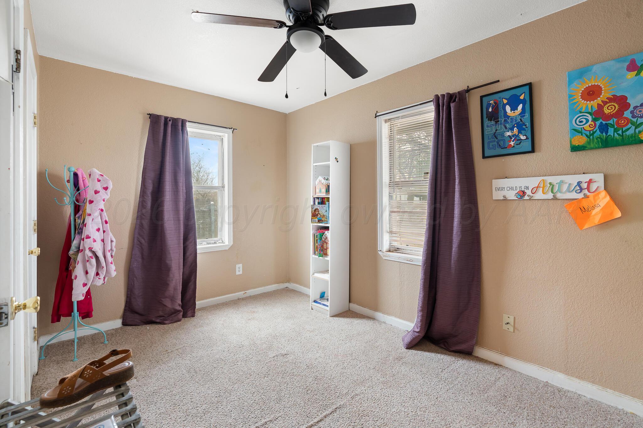 4603 Parker Street Amarillo, TX 79110 - Photo 14 of 20 a view of an empty room with window and closet