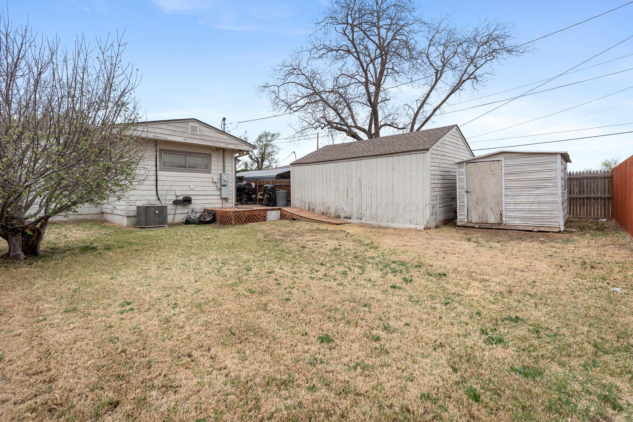 4603 Parker Street Amarillo, TX 79110 - Photo 19 of 20 a view of a house with a yard