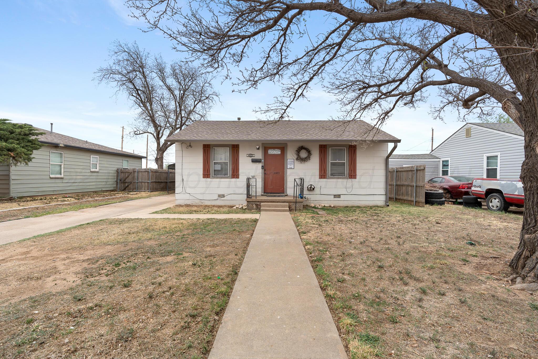 4603 Parker Street Amarillo, TX 79110 - Photo 4 of 20 a house with trees in front of it