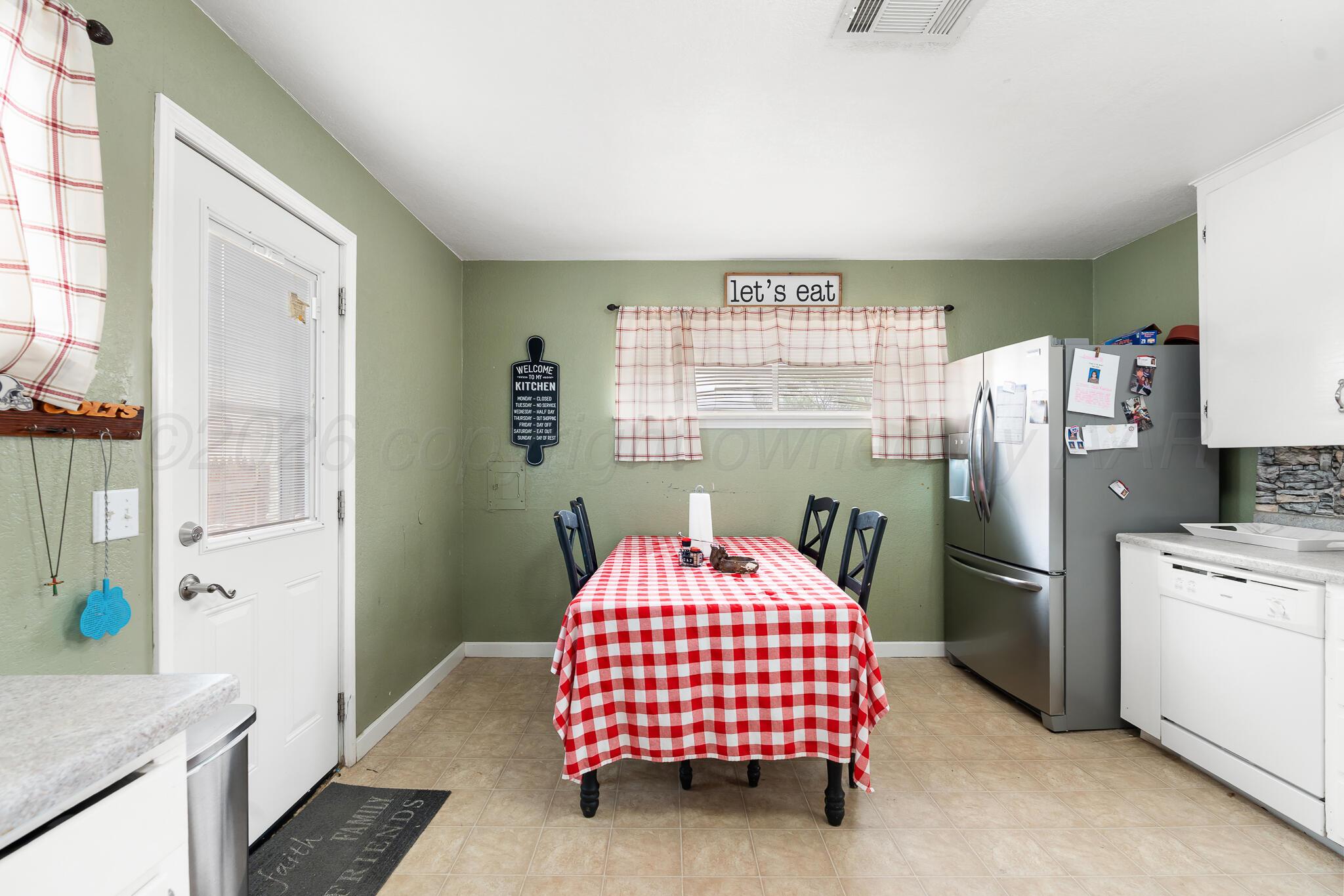 4603 Parker Street Amarillo, TX 79110 - Photo 8 of 20 a bedroom with a bed and wooden floor