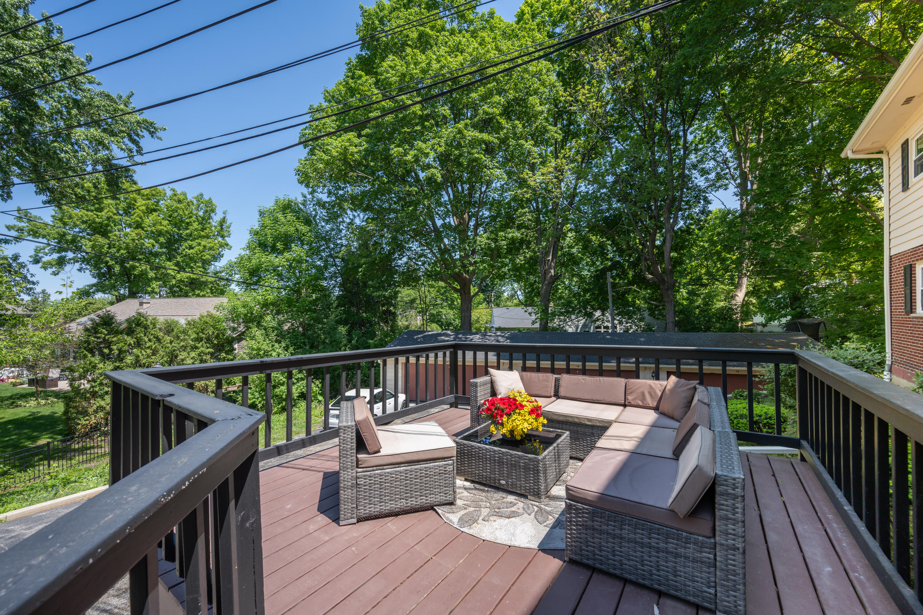 13350 West Bluemound Road, Unit 2 Elm Grove, WI 53122 - Photo 19 of 22 Summer outdoors on the deck