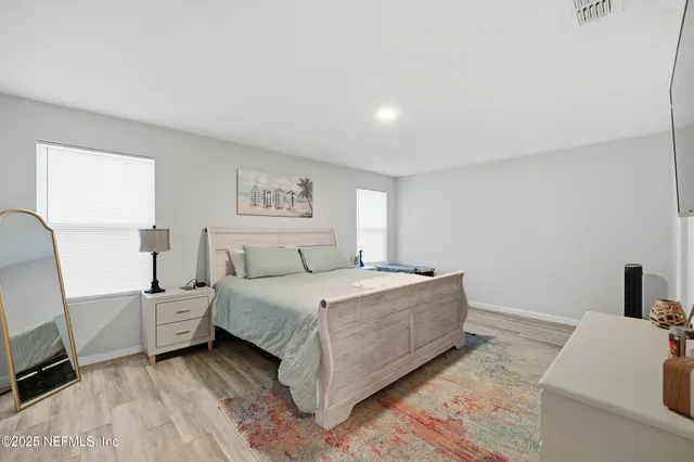 a room with a bed and a chair