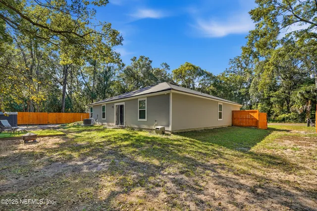 a backyard of a house with lots of green space