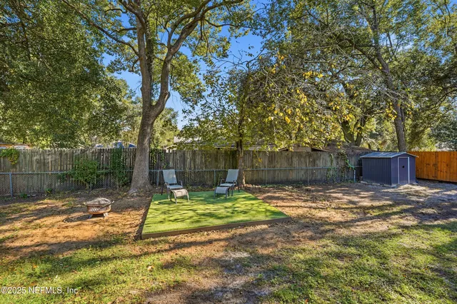 a aerial view of a house with a yard