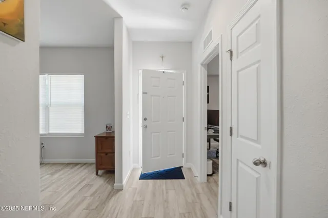 a view of a livingroom with furniture and a flat screen tv