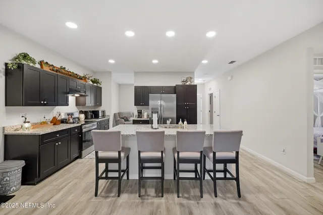 a kitchen with counter space cabinets and stainless steel appliances