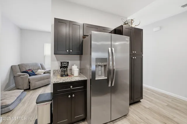 a living room with kitchen island furniture and a couch