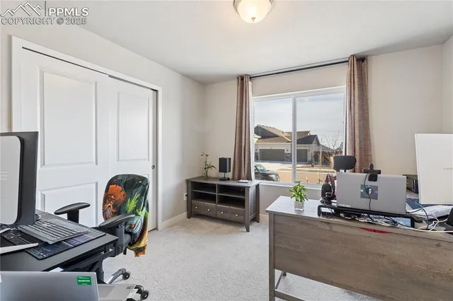 a bedroom with furniture and a window