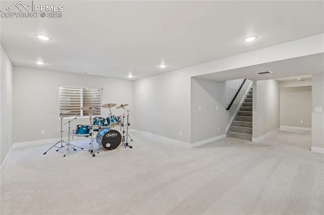 a view of livingroom with furniture and stairs