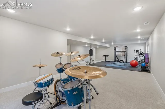 a room with furniture a dining table and chairs