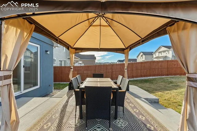 a table and chairs in the outdoor space