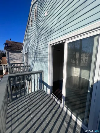 a view of a balcony with two chairs