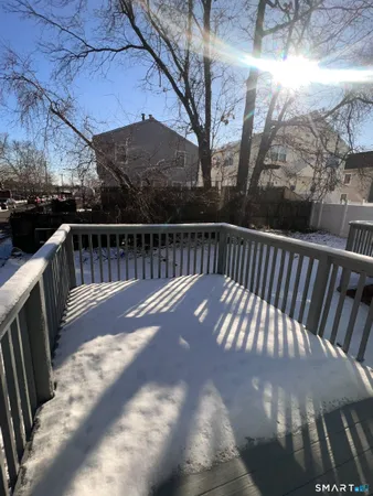a view of balcony with wooden floor