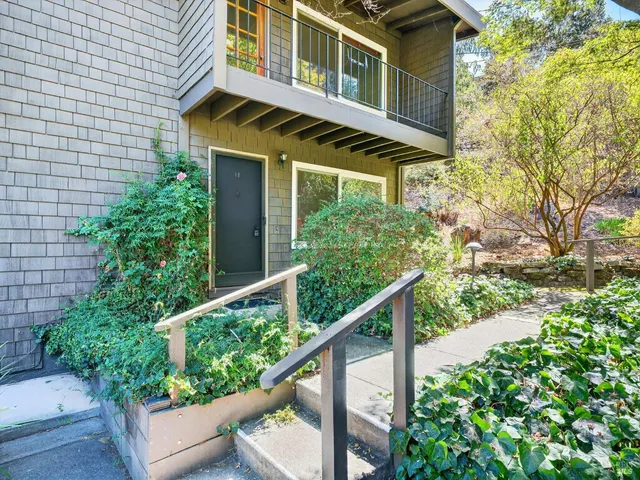 a front view of a house with trees