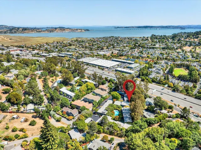 an aerial view of a house with a yard