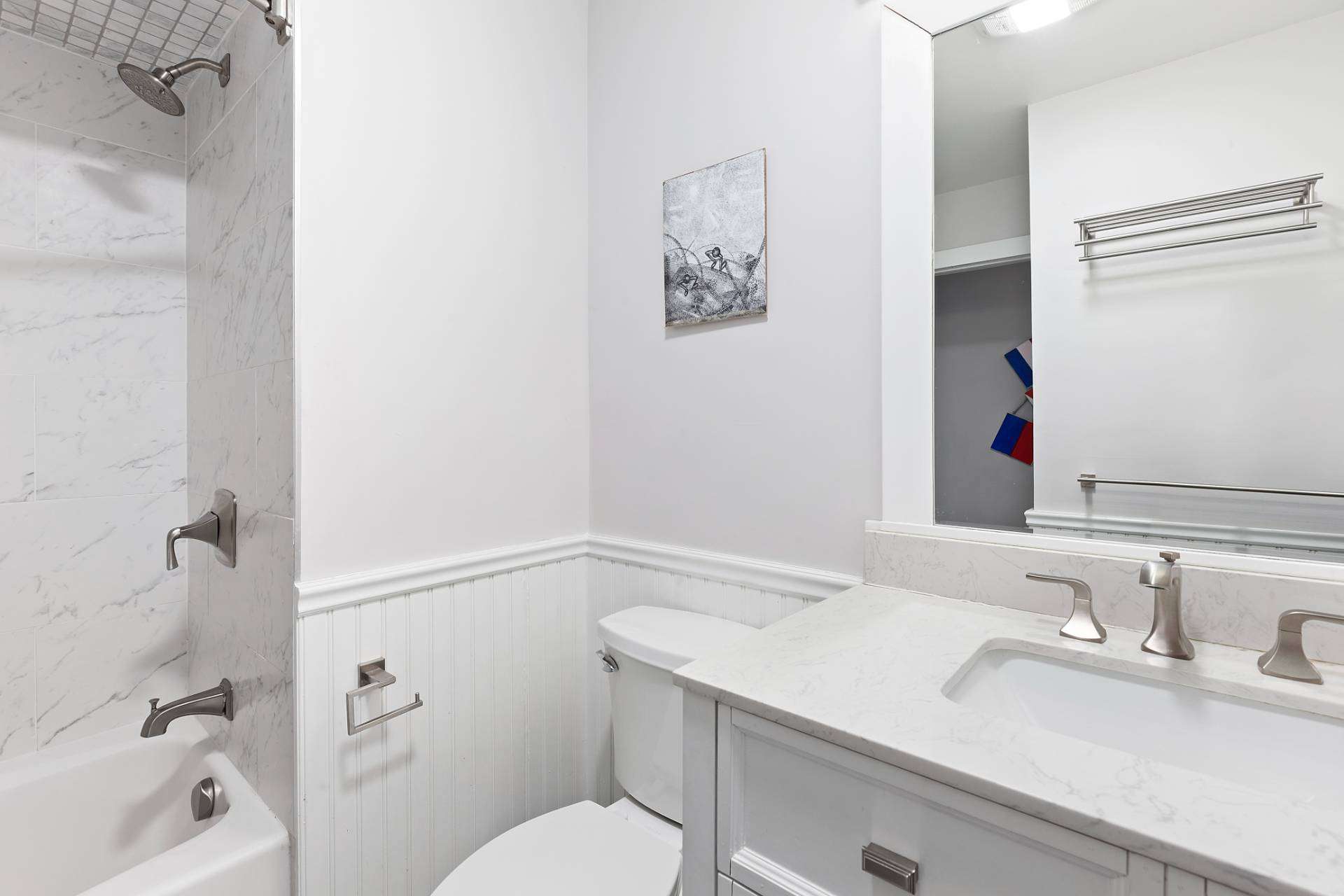 26 Whooping Hollow Road East Hampton, NY 11937 - Photo 13 of 18 a bathroom with a sink vanity mirror and toilet