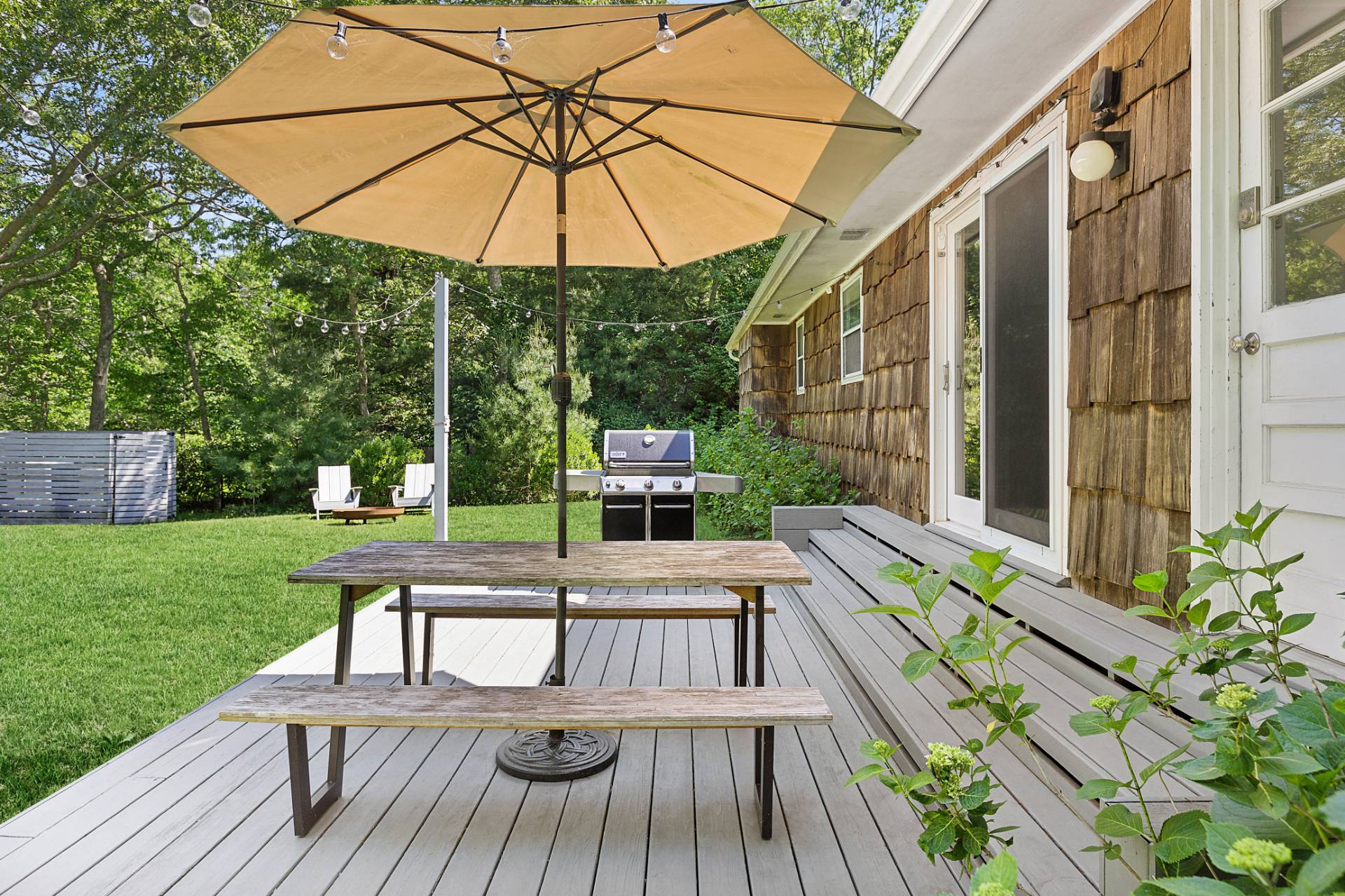 26 Whooping Hollow Road East Hampton, NY 11937 - Photo 16 of 18 a view of a house with backyard and sitting area