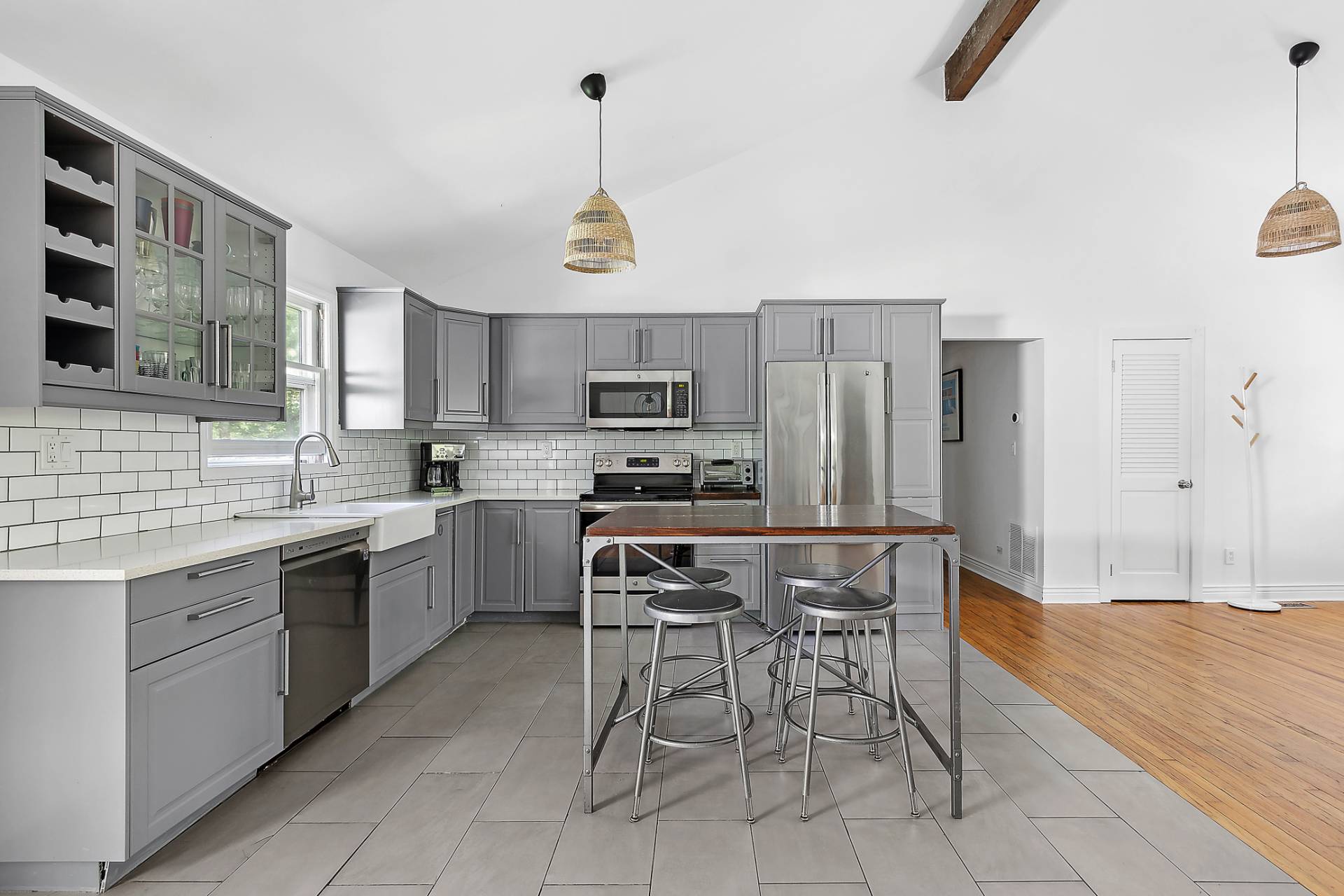 26 Whooping Hollow Road East Hampton, NY 11937 - Photo 6 of 18 a kitchen with kitchen island granite countertop a counter space a sink appliances and cabinets