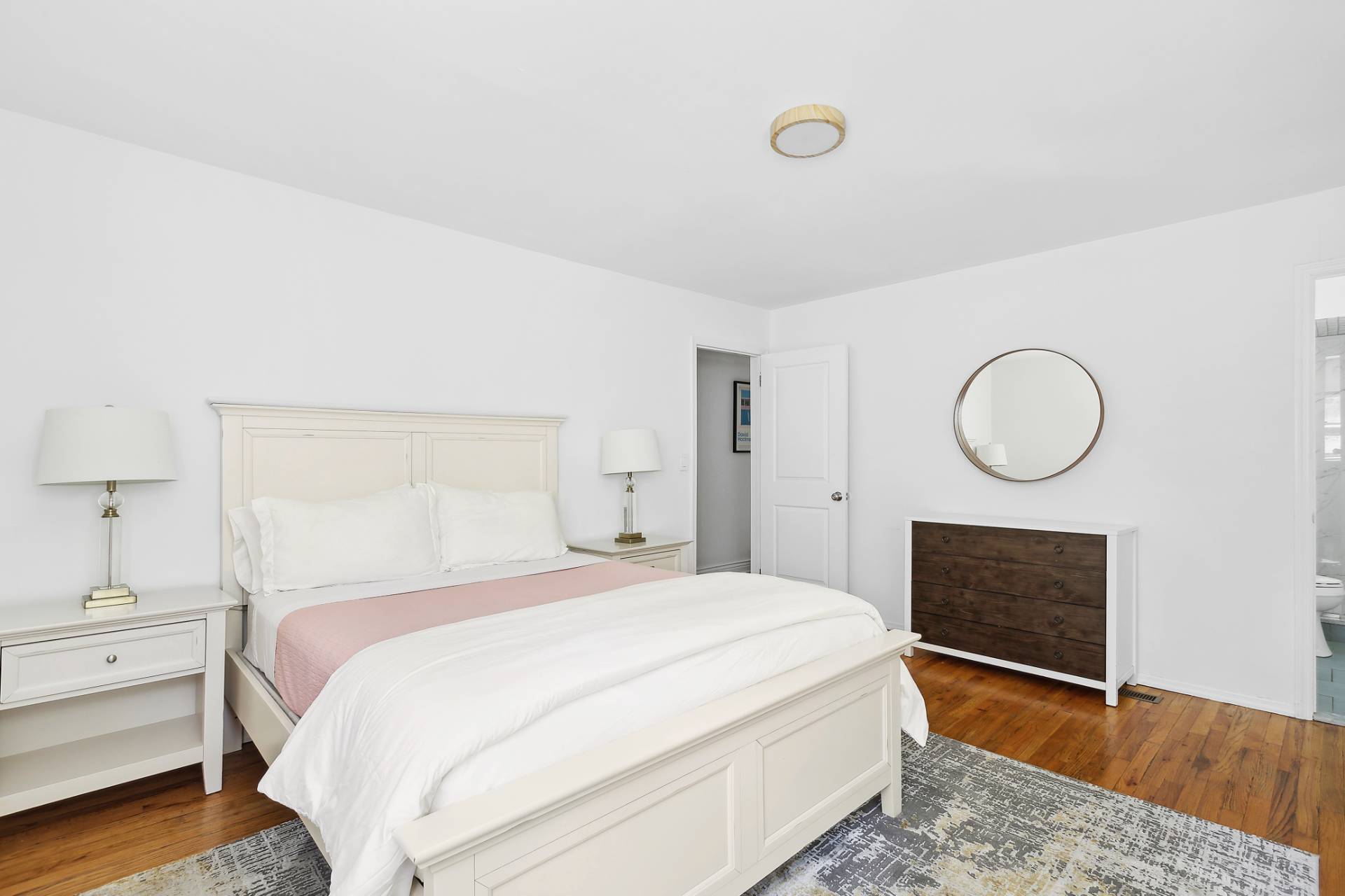 26 Whooping Hollow Road East Hampton, NY 11937 - Photo 9 of 18 a bedroom with a bed and a fireplace