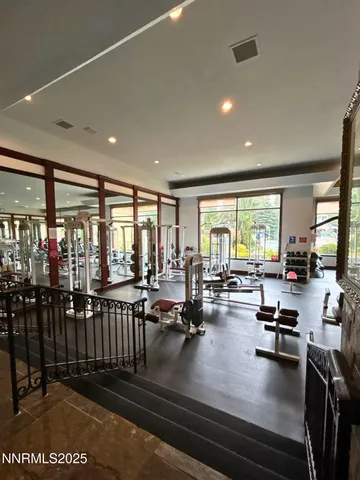 a room with gym equipment and a large window
