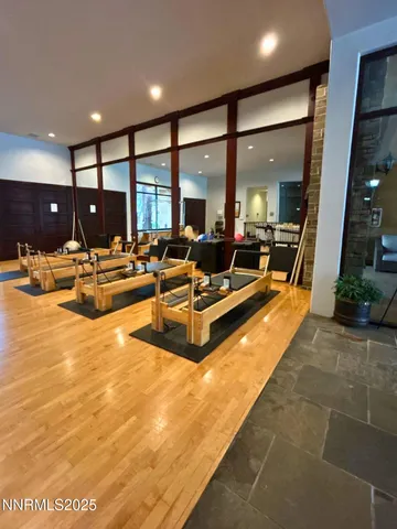 a living room with furniture pool table and a large window