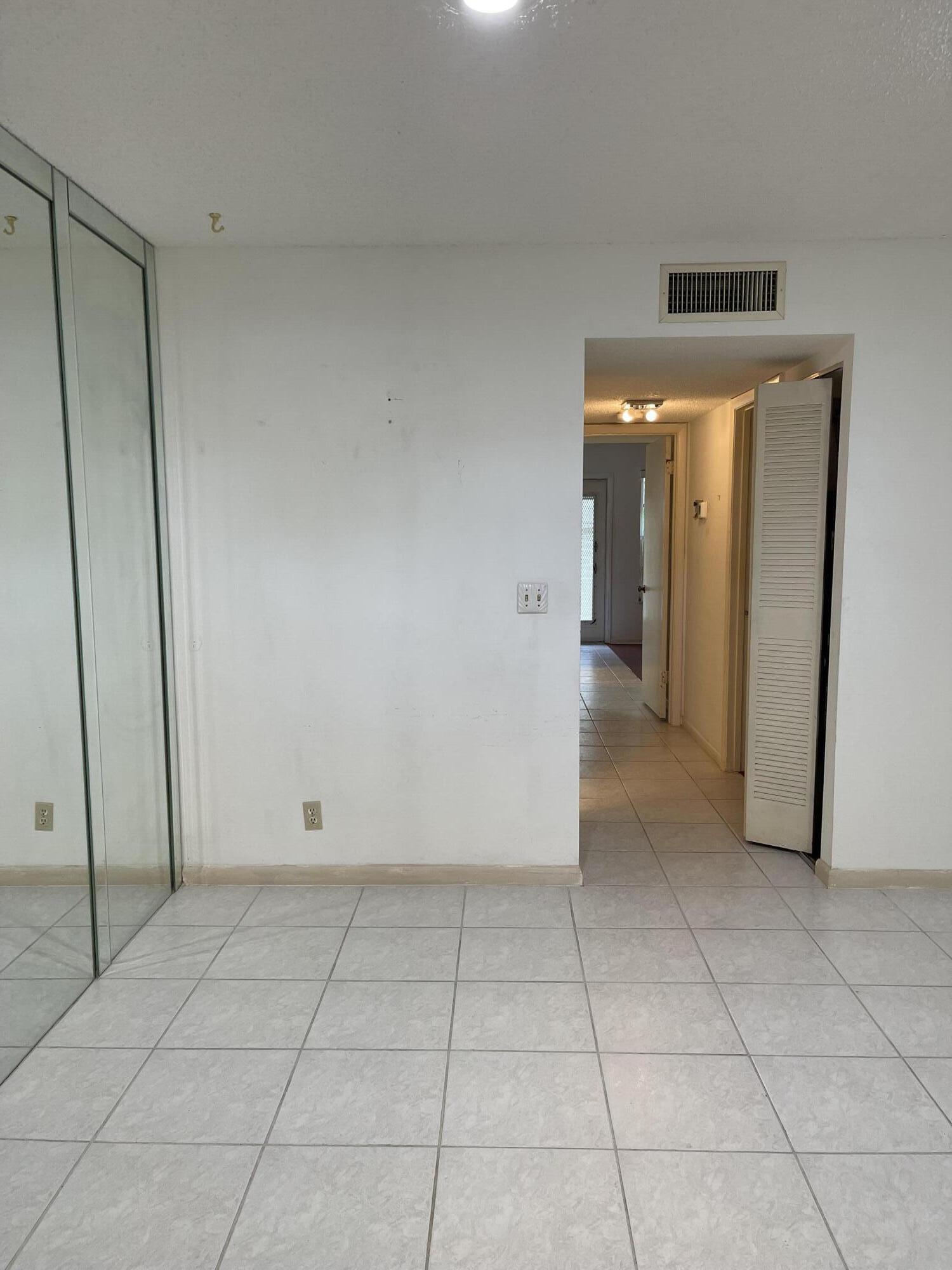4530 Northwest 2nd Street, Unit D Delray Beach, FL 33445 - Photo 11 of 31 a view of a hallway to rooms