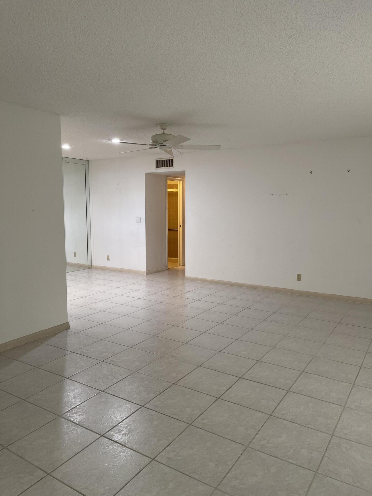 4530 Northwest 2nd Street, Unit D Delray Beach, FL 33445 - Photo 13 of 31 an empty room with a empty space and windows