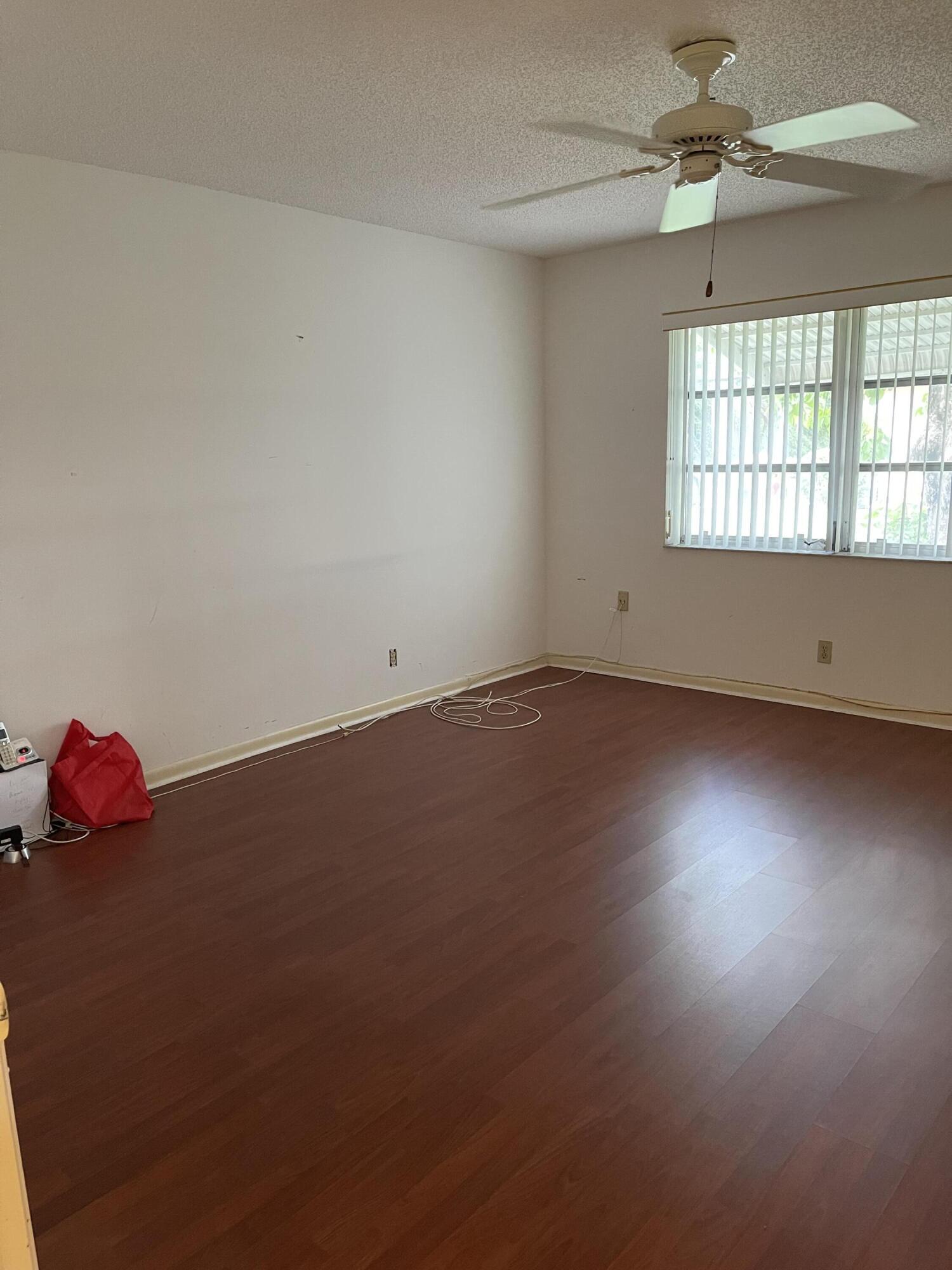4530 Northwest 2nd Street, Unit D Delray Beach, FL 33445 - Photo 19 of 31 an empty room with a window
