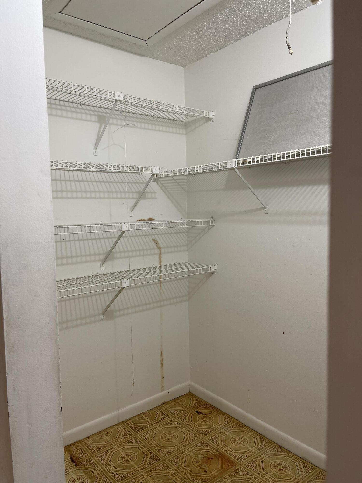 4530 Northwest 2nd Street, Unit D Delray Beach, FL 33445 - Photo 23 of 31 a view of a room with racks on the wall