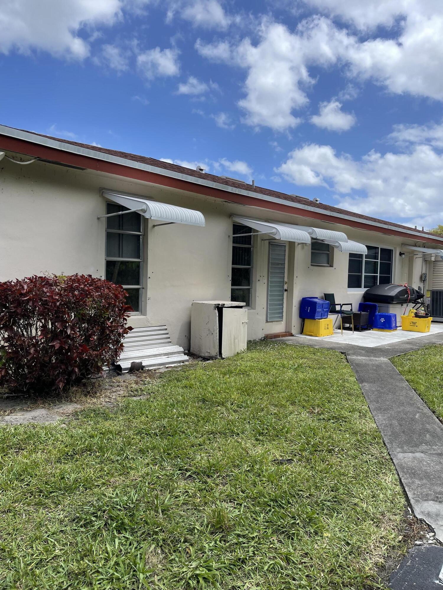 4530 Northwest 2nd Street, Unit D Delray Beach, FL 33445 - Photo 24 of 31 a view of a house with backyard and porch