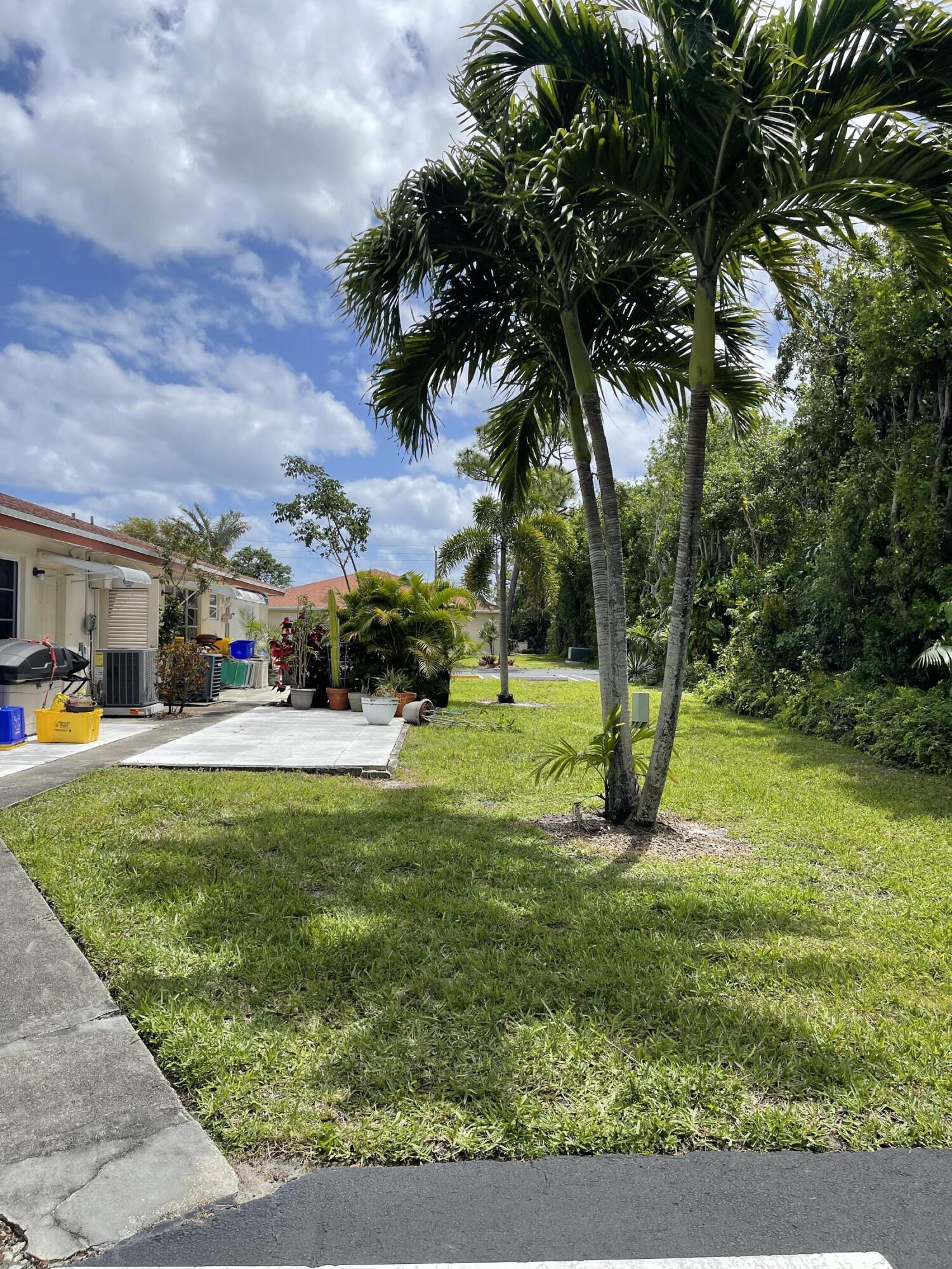 4530 Northwest 2nd Street, Unit D Delray Beach, FL 33445 - Photo 25 of 31 a view of a park with swings and slides
