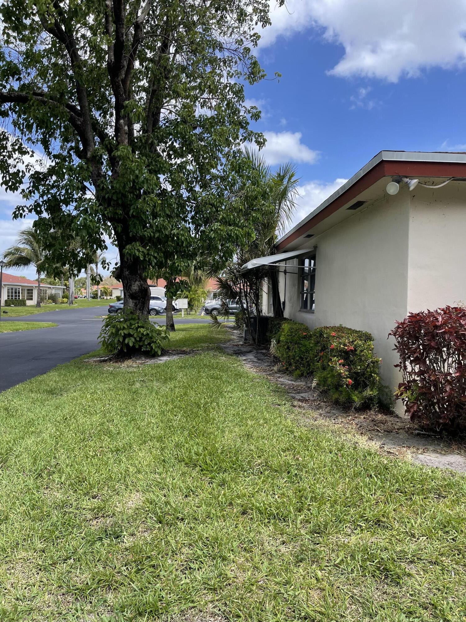 4530 Northwest 2nd Street, Unit D Delray Beach, FL 33445 - Photo 27 of 31 a backyard of a house with lots of green space