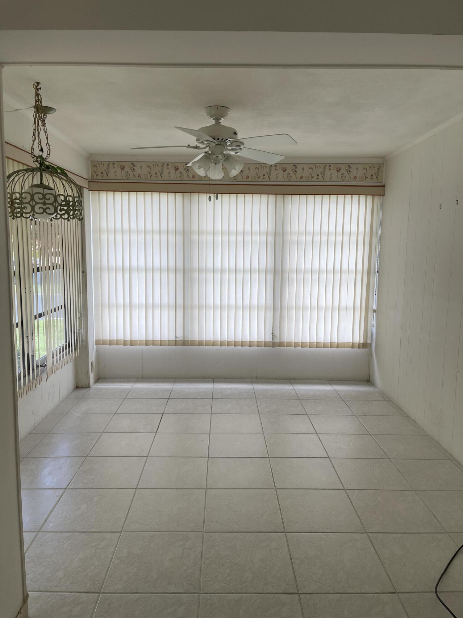 4530 Northwest 2nd Street, Unit D Delray Beach, FL 33445 - Photo 5 of 31 a view of an empty room with a window
