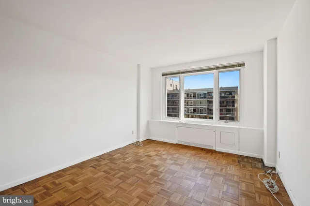a view of an empty room with a window