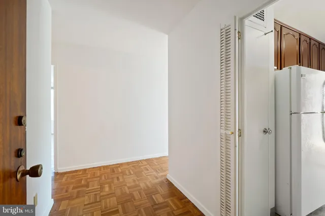 a lobby with furniture and large windows