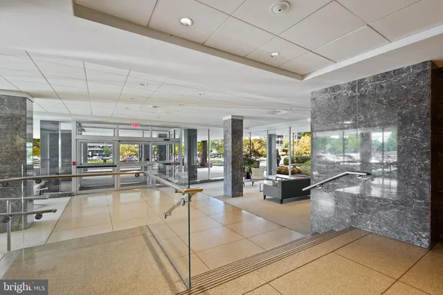 a view of a dining room and hall with wooden floor