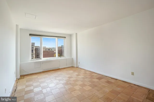a view of an empty room with a window