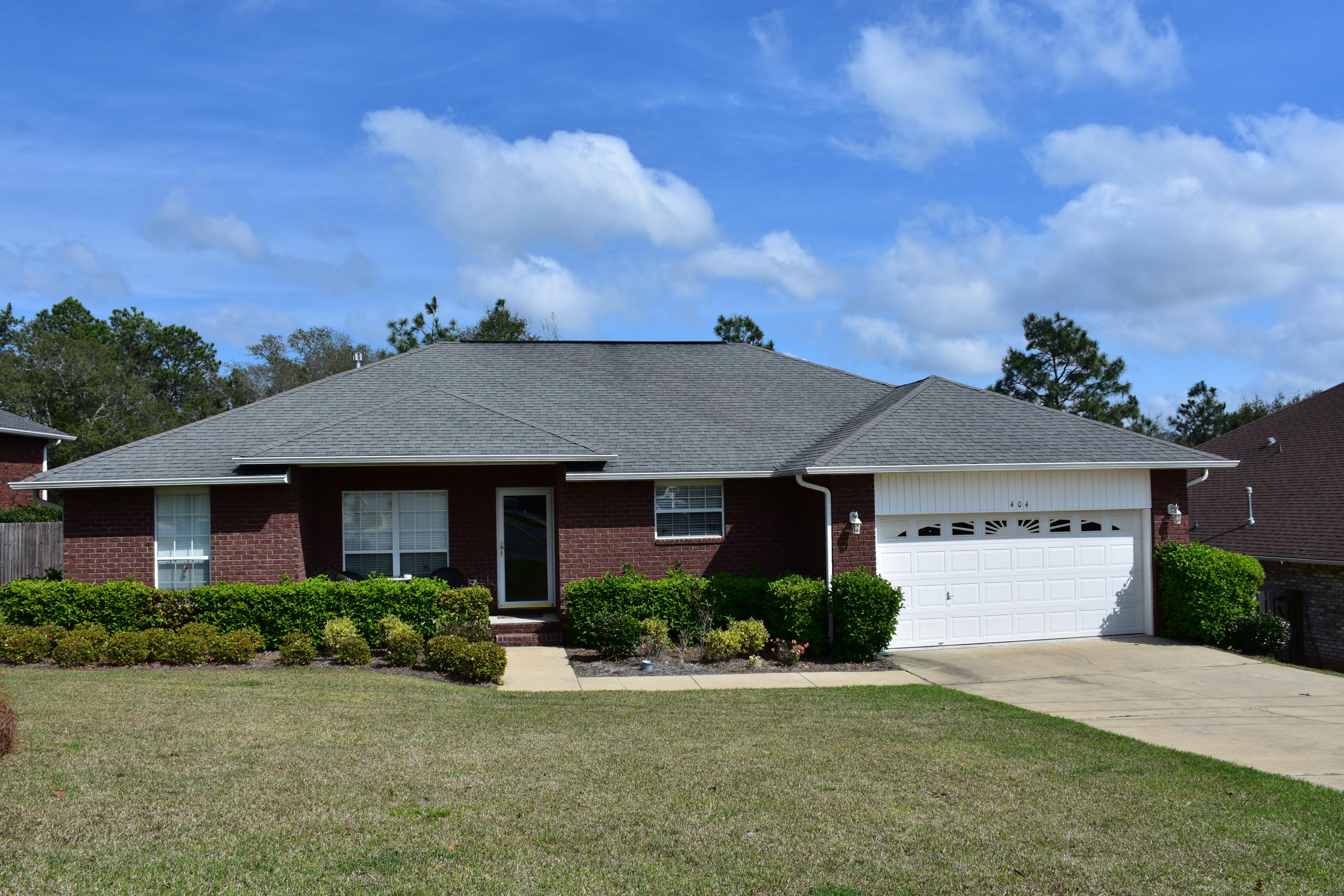 404 Swift Fox Run Crestview, FL 32536 - Photo 1 of 37 front view of a house with a yard