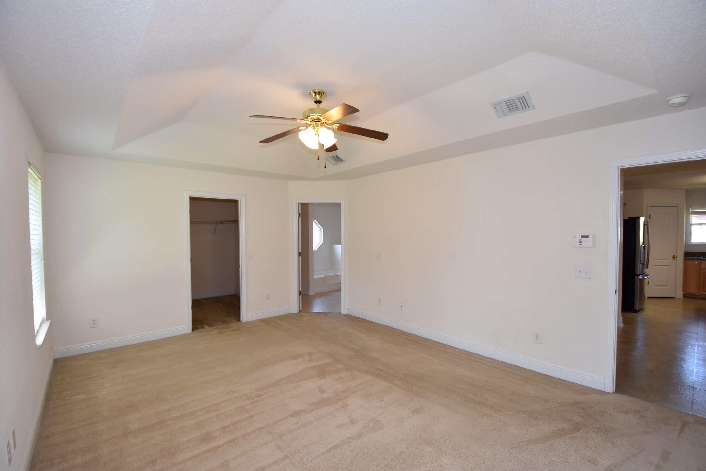 404 Swift Fox Run Crestview, FL 32536 - Photo 18 of 37 a view of an empty room with a ceiling fan