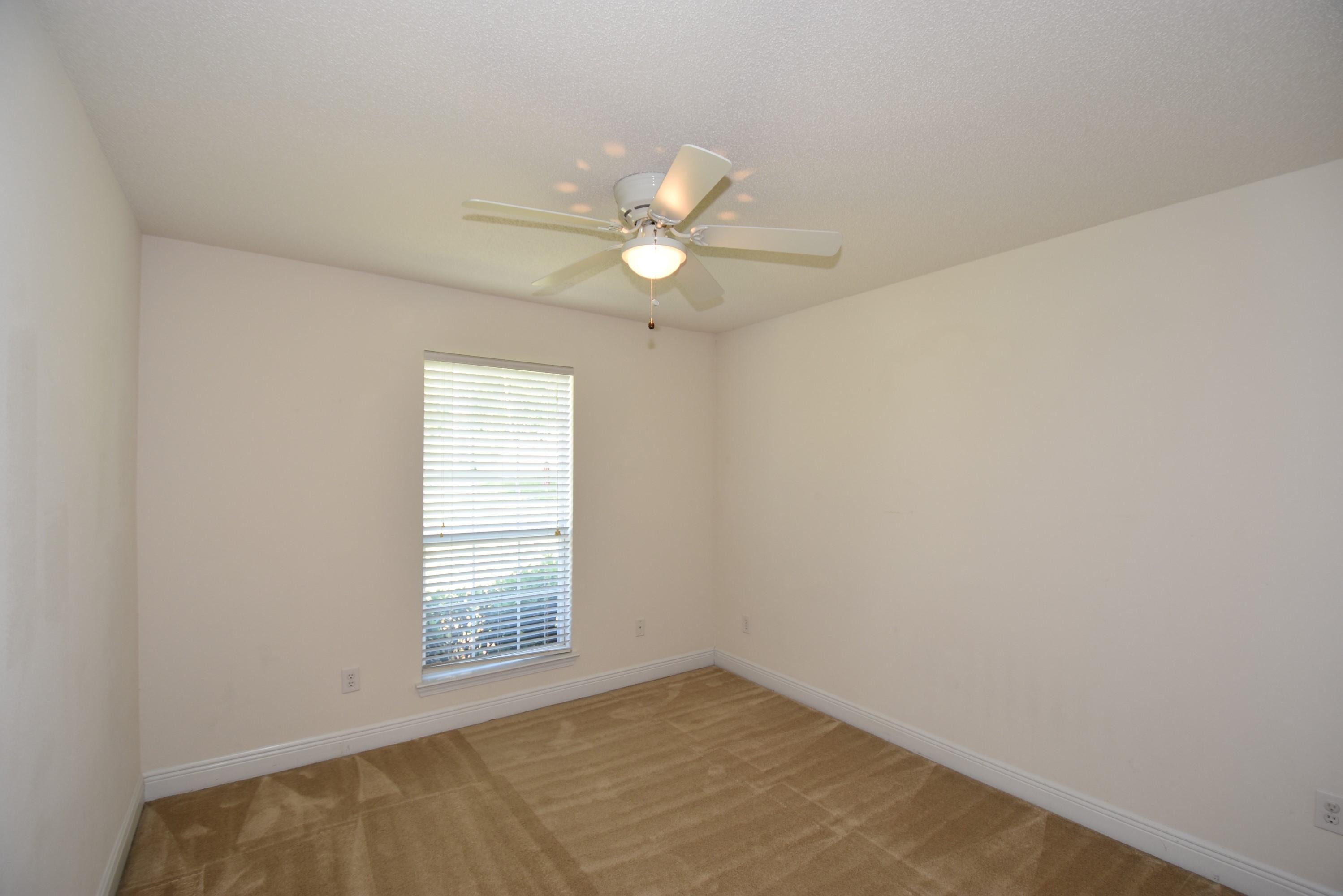 404 Swift Fox Run Crestview, FL 32536 - Photo 23 of 37 a view of an empty room with a window
