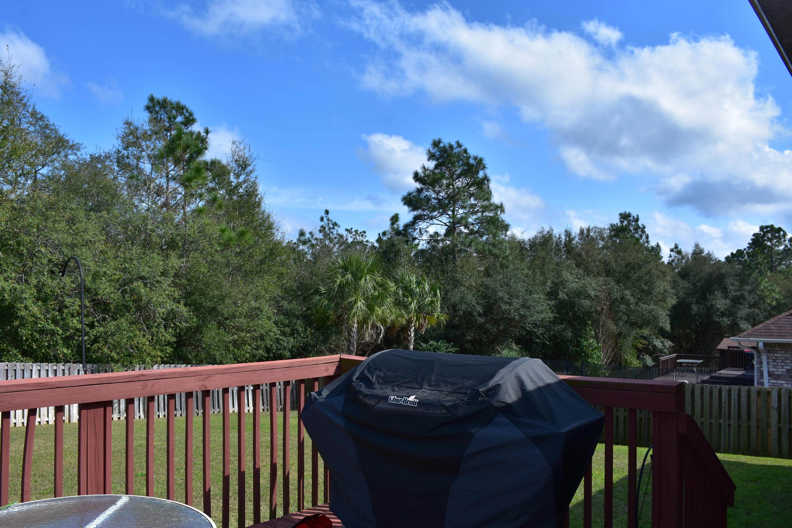 404 Swift Fox Run Crestview, FL 32536 - Photo 30 of 37 a view of a roof deck with couches and wooden floor