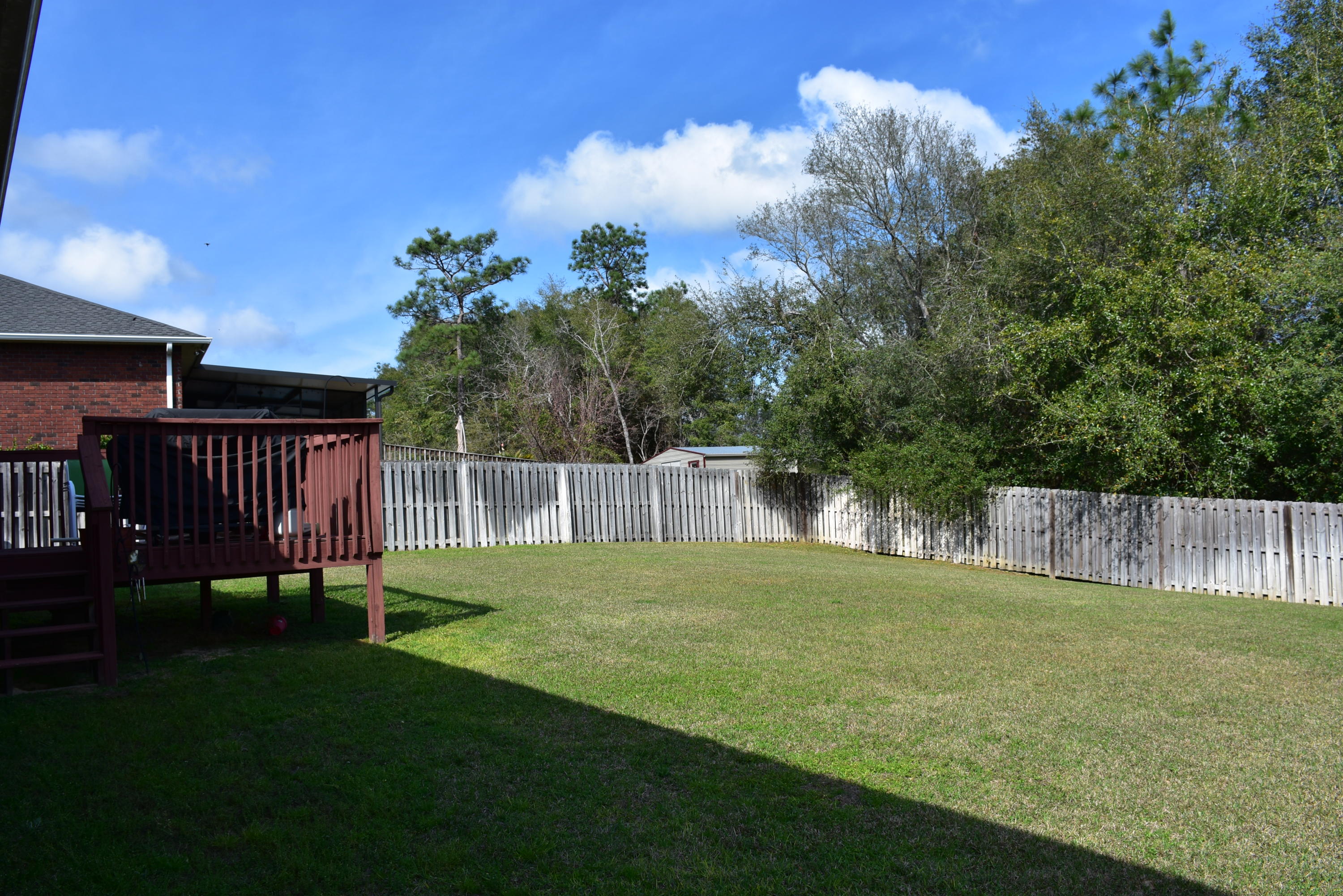 404 Swift Fox Run Crestview, FL 32536 - Photo 32 of 37 a view of a backyard with a garden