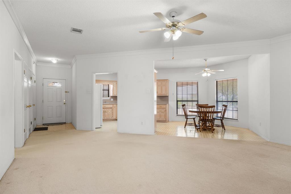 162 Warren Road Lorena, TX 76655 - Photo 7 of 39 White walls throughout with carpeted flooring in the main area