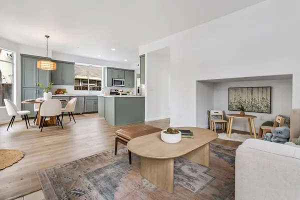 a view of a dining room with furniture and wooden floor