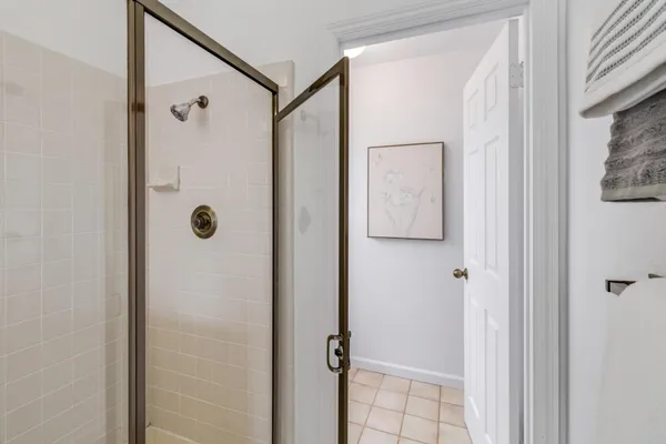 a bathroom with a shower and a sink