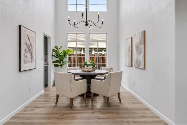 a view of a dining room with furniture window and wooden floor
