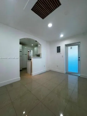 a view of a livingroom with a kitchen